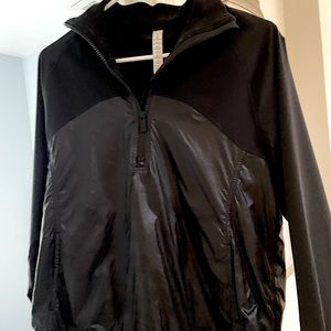 Lulu Lemon size 6 1/4 zip black athletic pull over. Looks brand new. Worn once.